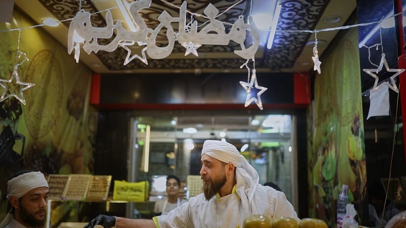 ** Syrian families gather around table filled with traditional white yogurt-based Ramadan dishes