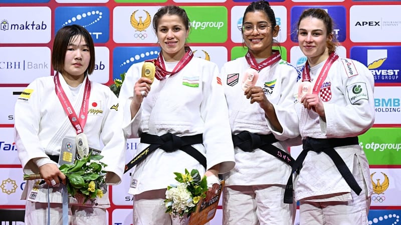Uzbek judoka Shukurjon Aminova celebrating gold medal victory at Tashkent Grand Slam competition