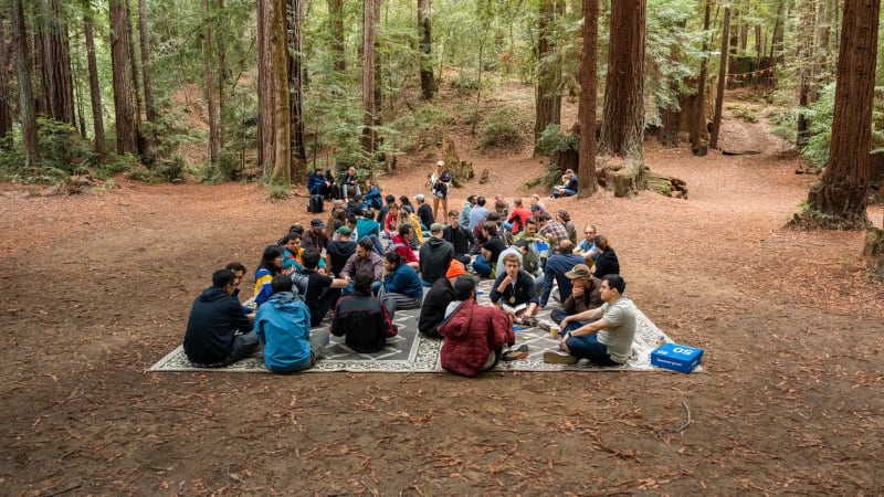 Scientists and engineers collaborating in modern startup workspace with research equipment and technology