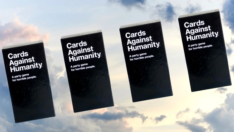 Cards Against Humanity game box on table representing customer-focused refund policy