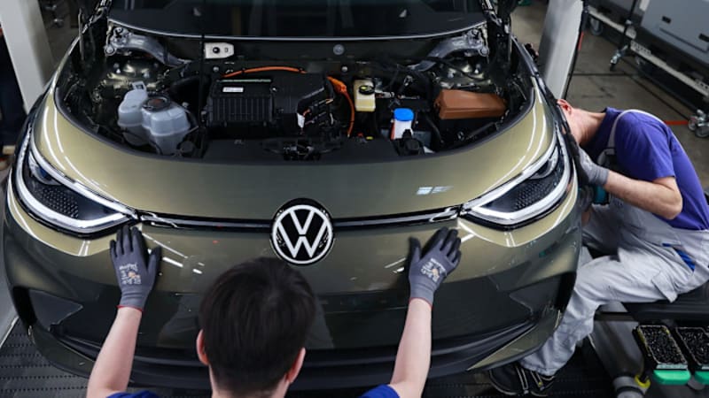 Modern electric vehicle charging at a public station in a European city