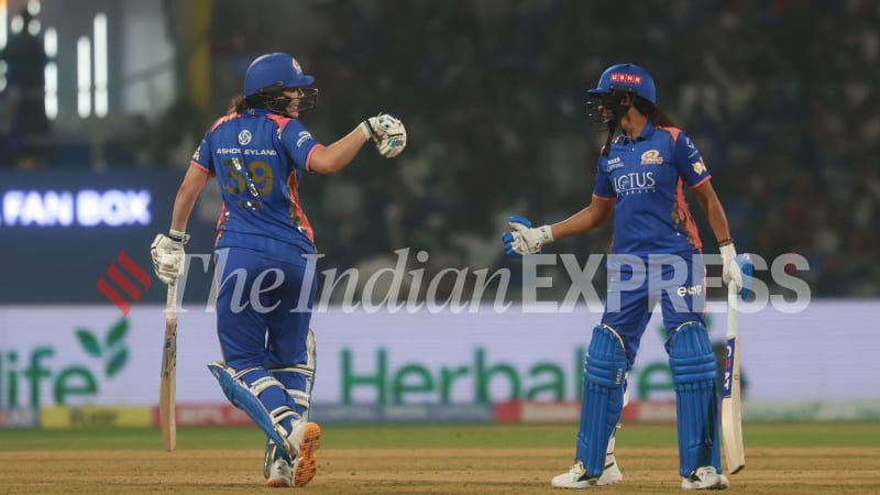 ** Mumbai Indians cricketers Harmanpreet Kaur and Natalie Sciver-Brunt celebrating during their commanding victory over Delhi Capitals