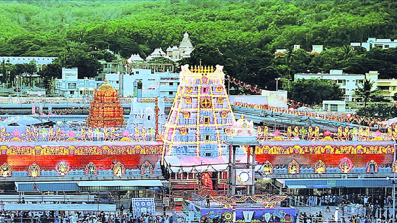 Devotees gathering at the magnificent Sri Venkateswara Swamy Temple in Tirumala for darshan prayers and blessings