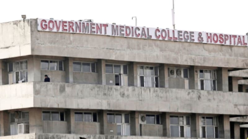 Doctor using laptop computer to access patient digital health records in modern hospital setting