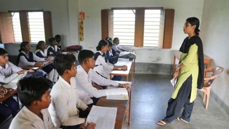 Happy Indian students in classroom smiling with supportive teacher, representing positive mental health support in Maharashtra schools