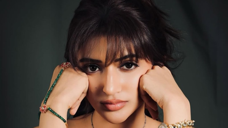 Sreeleela smiling warmly, representing her compassionate journey as a young adoptive mother and actress inspiring positive change