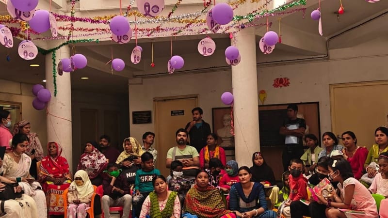 Children and families gathered at hospital event with colorful decorations and entertainment performances in Kolkata
