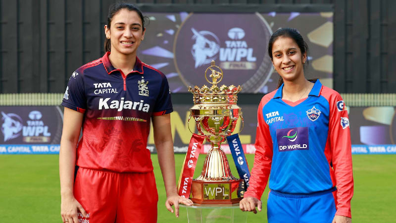 Cricket captains Smriti Mandhana and Jemimah Rodrigues smiling together at press conference before championship final