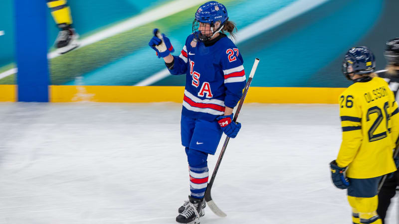 U.S. women's hockey team celebrates on ice after defeating Sweden in Olympic semifinals