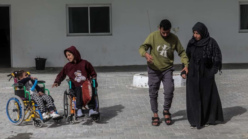 Palestinian patients and family members crossing Rafah border into Egypt for medical treatment