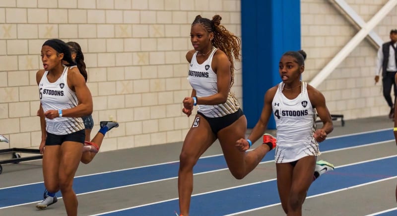 Lillian Hurd sprinting on indoor track at Indianapolis Crossroads of America meet