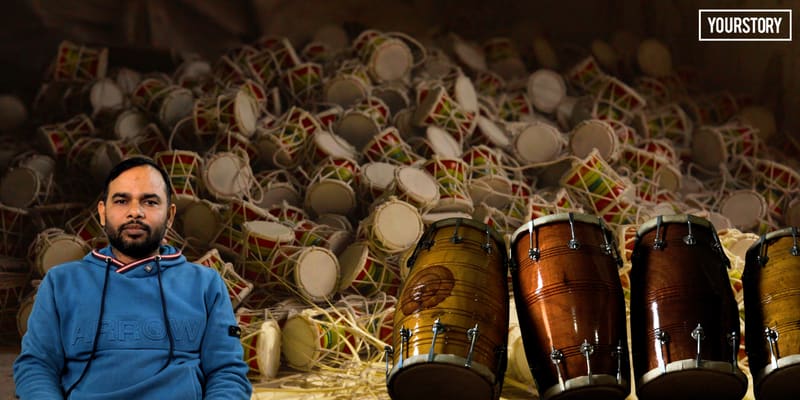 Artisan's hands stretching goat skin over hollow mango wood dholak drum frame in Amroha workshop