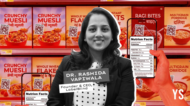 Dr. Rashida Vapiwala, founder of LabelBlind, standing confidently with food product packages displaying clear nutrition labels