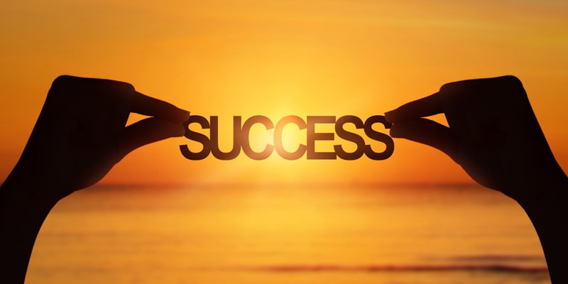 Person sitting peacefully in natural light, reflecting calmly with gentle expression showing inner peace