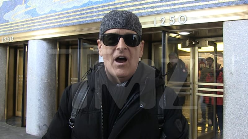 Dave Coulier smiling outdoors in New York City after completing cancer treatment