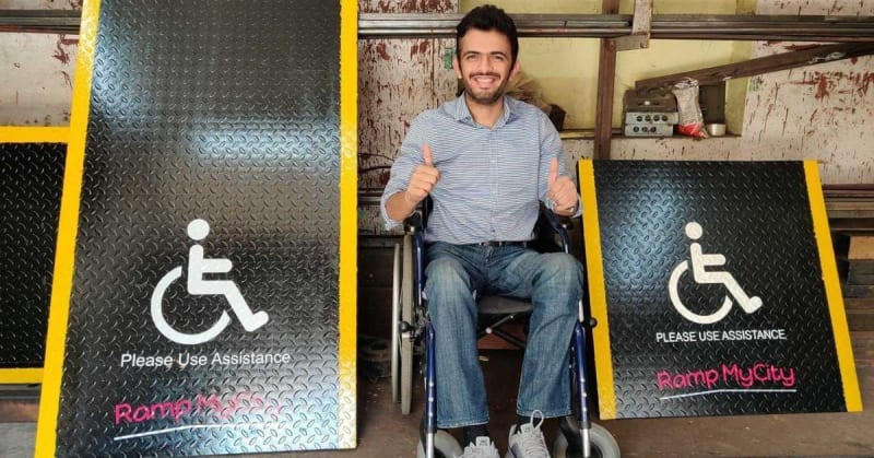 Prateek Khandelwal in wheelchair beside newly installed accessibility ramp in Indian public space