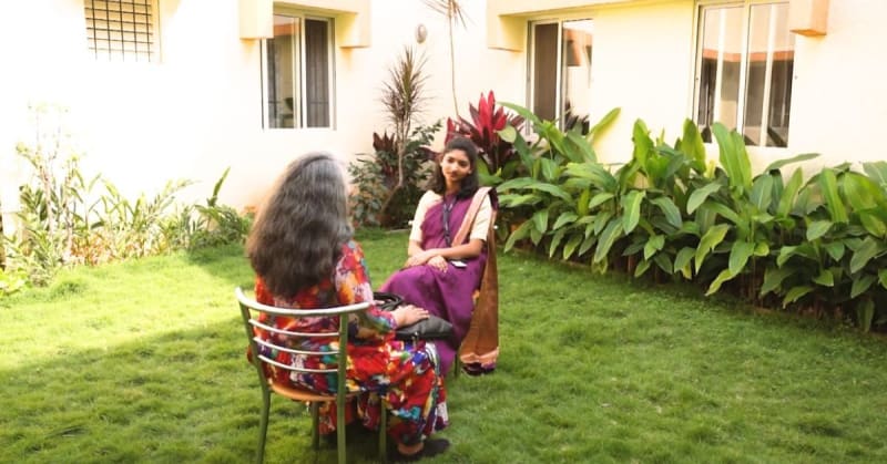 Indian mother and teenage son walking together outdoors, representing mental health recovery and family support in Bengaluru