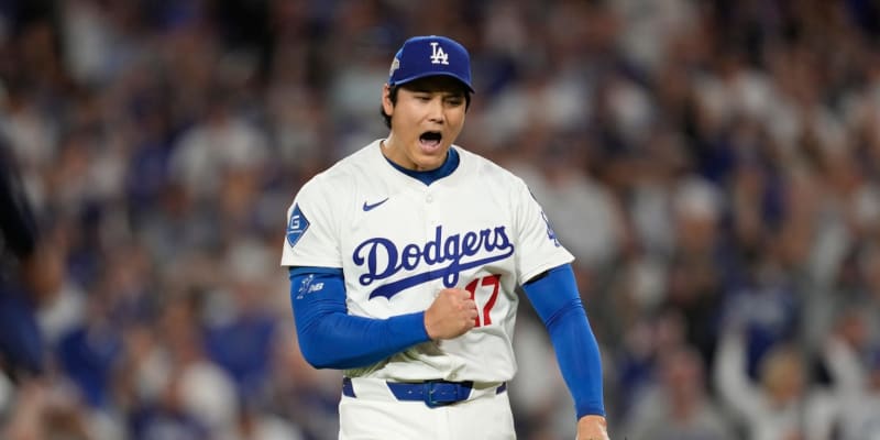 Shohei Ohtani in Dodgers uniform mid-pitch delivery showing powerful throwing motion on the mound