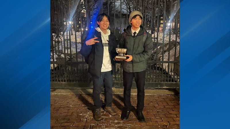 Two Little Rock Central High School debate champions celebrating their Harvard tournament victory