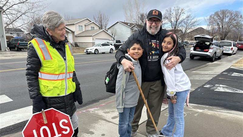 Crossing guard Kirk Nixon smiling with school nurse Jill Anderson who saved his life