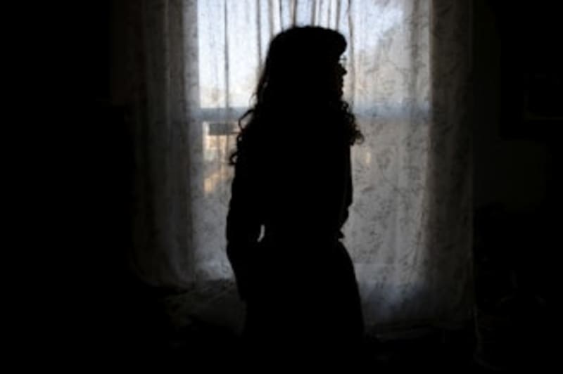 ** Healthcare volunteer with medical bag visiting family at home in Minneapolis