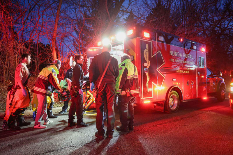 Firefighters conducting ice rescue operations on frozen Lake Killarney near Cary, Illinois