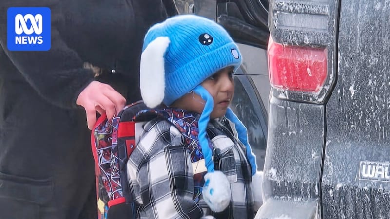 Five-year-old boy in bunny hat and Spiderman backpack with immigration officers in Minnesota