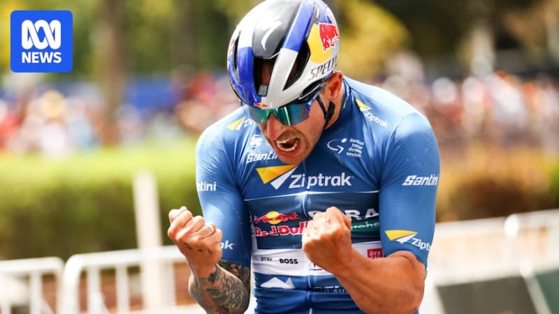 Australian cyclist Sam Welsford sprinting powerfully during a professional road race wearing team jersey