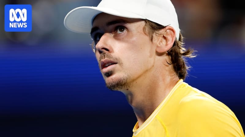 Alex de Minaur preparing for serve at Australian Open tennis tournament in Melbourne