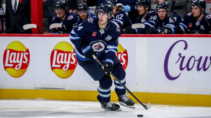 Winnipeg Jets defenseman Haydn Fleury in team uniform on ice during NHL game action