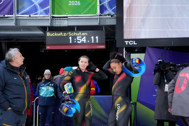 German bobsledders Laura Nolte and Deborah Levi crossing finish line at 2026 Winter Olympics