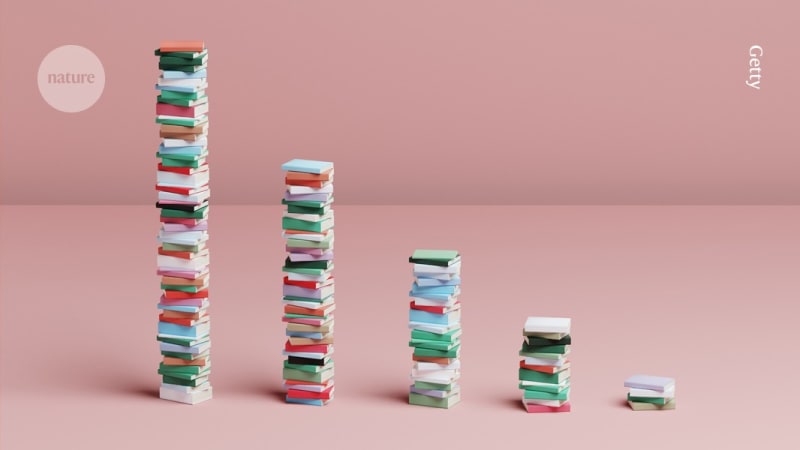 Scientist working carefully at desk with research papers and computer, focused on quality over quantity