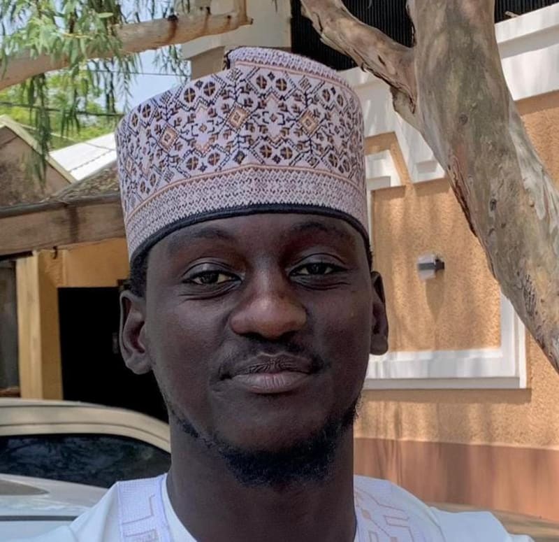 ** Nigerian cattle grazing peacefully in designated ranch area with improved infrastructure and community oversight