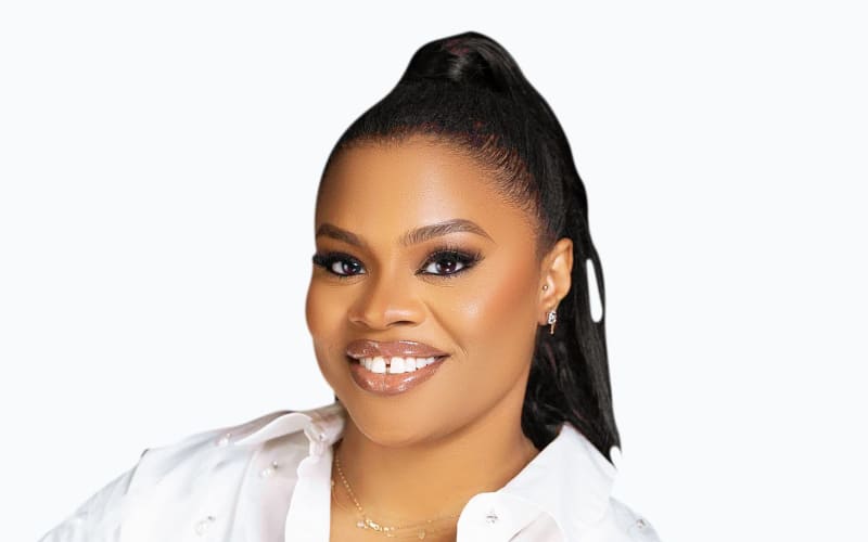 Vibrant Lagos city skyline with modern tech office buildings and entrepreneurs collaborating in innovation hub