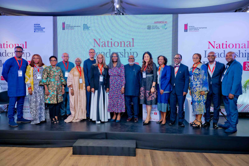 Diverse group of Nigerian leaders engaged in dialogue at Lagos leadership conference