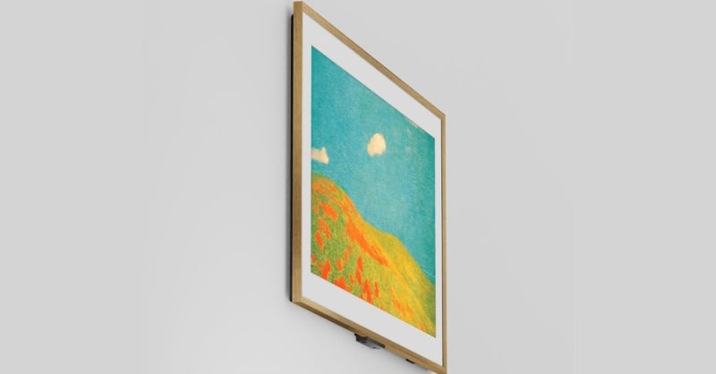 Modern living room featuring a flat-screen TV displaying colorful artwork in an elegant frame mounted on wall