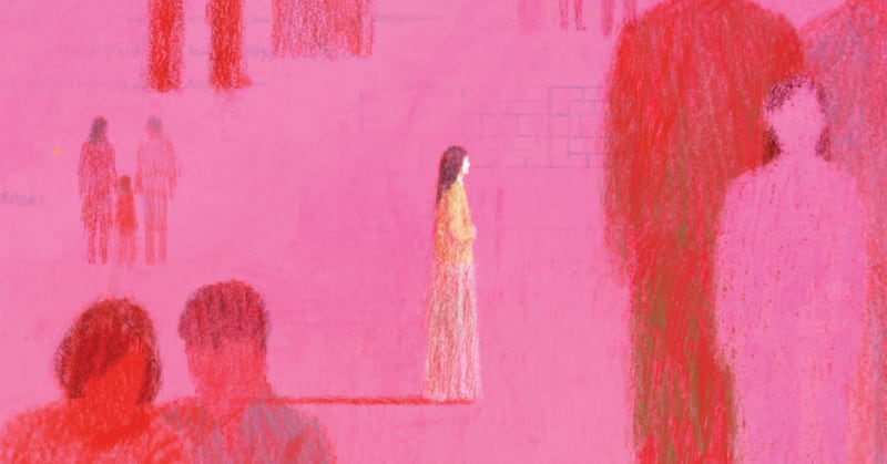 ** Young woman looking thoughtfully at old photograph, representing search for biological family and personal history