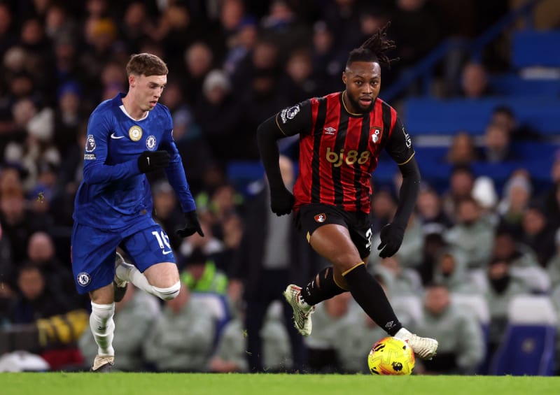Antoine Semenyo in action on the football pitch wearing his Bournemouth kit during a Premier League match