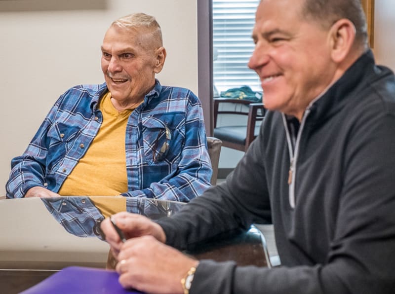 ** Medical team poses with patient Tyson Johnson in Pluvicto treatment room at Texas Oncology Longview