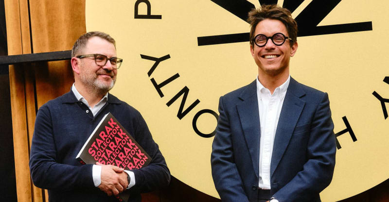Igor Czernecki and Jerzy Starak standing with scholarship recipients holding certificates