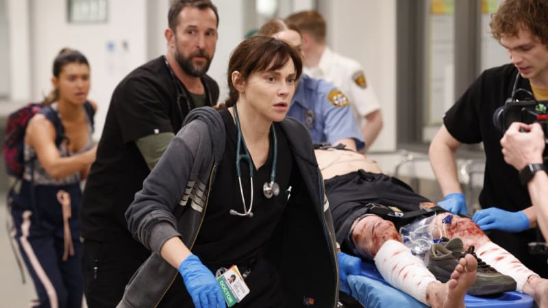 Actor Noah Wyle in doctor's scrubs portraying an emergency room physician in HBO's uplifting medical drama The Pitt