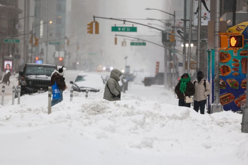 Woman Clears Snow Path With Bare Hands for NYC Elderly Lady