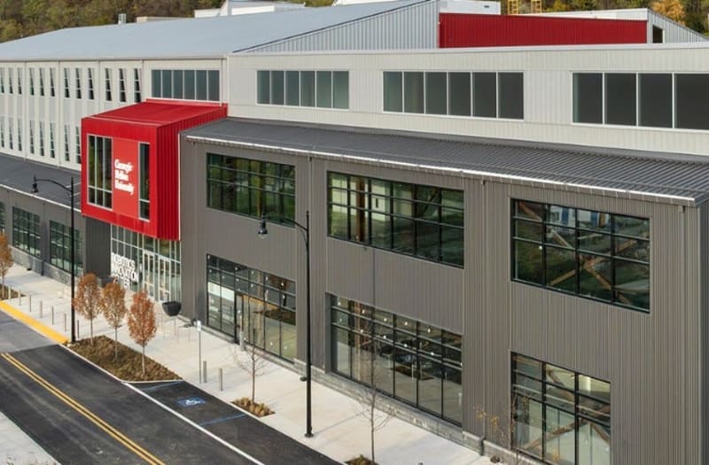 Large modern robotics research facility at Carnegie Mellon University with outdoor testing grounds