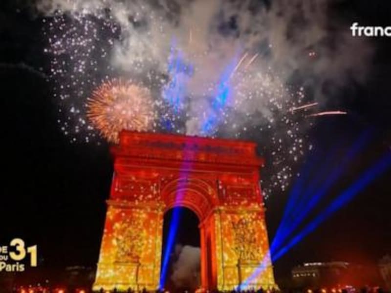 Midnight Magic: Paris Sparkles with New Year's Celebration at Arc de Triomphe