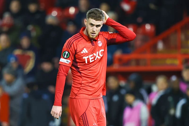 Young footballer Alfie Dorrington in Tottenham Hotspur training gear during practice session, representing youth development success