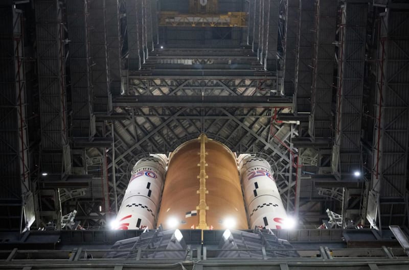 NASA's Space Launch System rocket stands tall in assembly building at Kennedy Space Center, ready for historic Artemis 2 moon mission