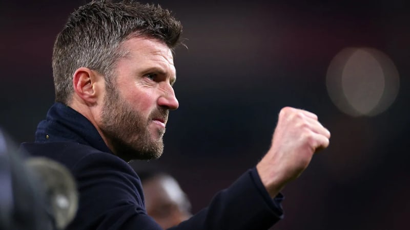 ** Michael Carrick celebrating on touchline as Manchester United scores against Arsenal at Emirates Stadium