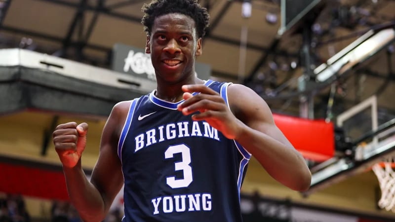 BYU Cougars basketball players celebrating during their impressive undefeated season streak at Marriott Center