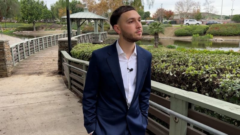 Young adult mentor talking with teenage foster youth in supportive conversation setting