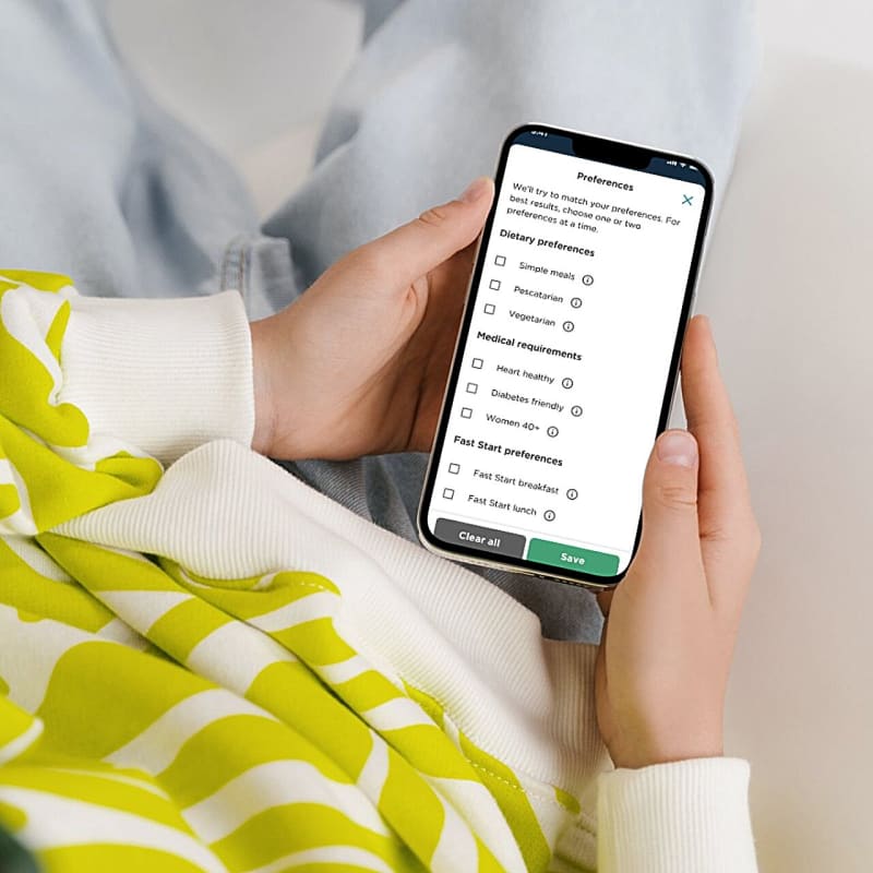 Smartphone displaying AI-powered meal planning app interface with personalized healthy food recommendations and nutrition guidance